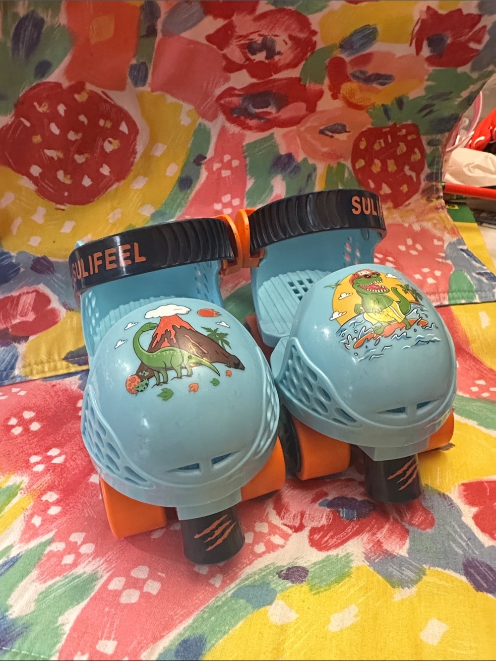 Kids Light Blue Dinosaur Roller Shoes with Orange Wheels